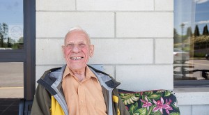 Happy man sitting outdoors