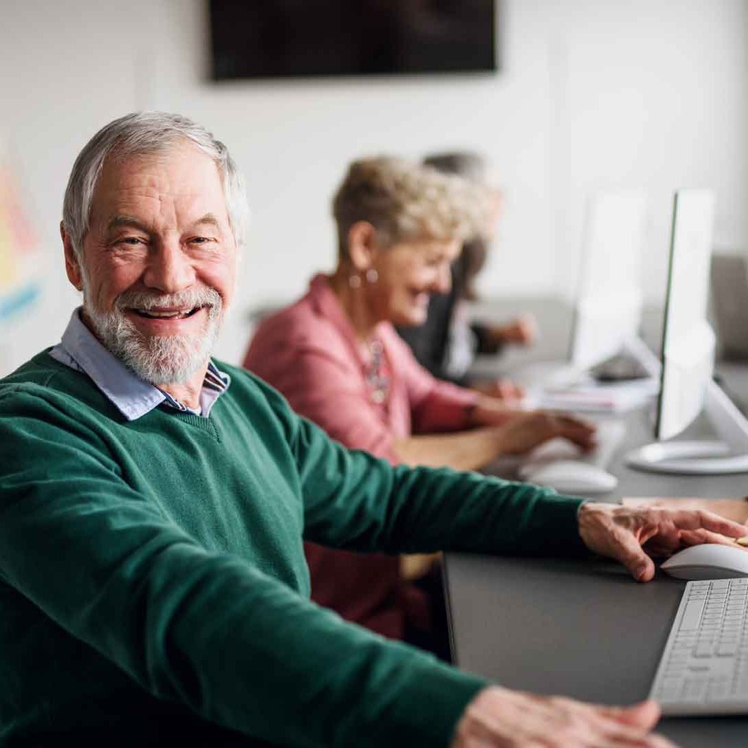 senior man at laptop computer senior gentleman at computer
