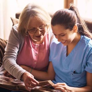 nurse and patient looking at card